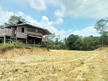 House on field against sky