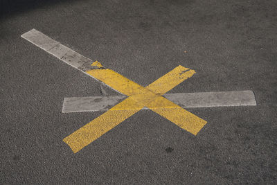 High angle view of arrow sign on road