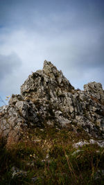 Low angle view of rock formations against sky