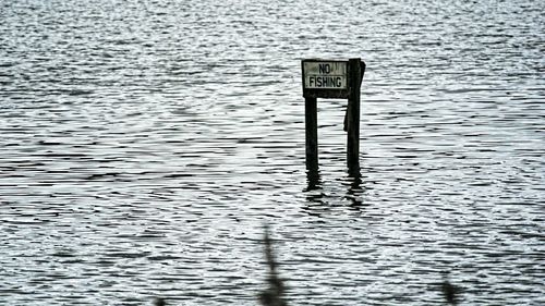 Information sign in water