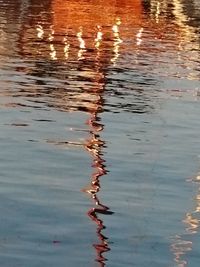 Reflection of rippled water in lake