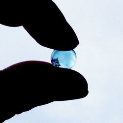 Low angle view of cropped object over white background