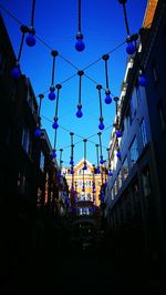 Low angle view of buildings against blue sky