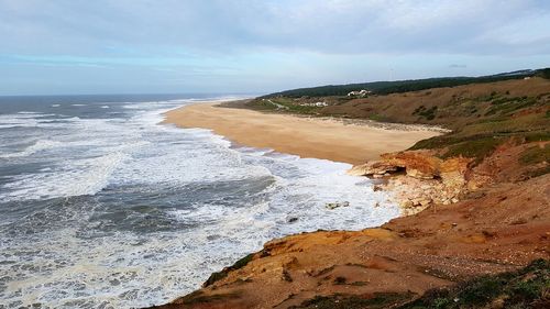 Scenic view of beach against sky