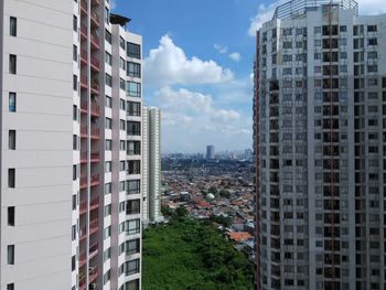 Skyscrapers in city against sky