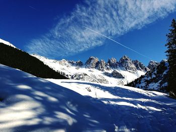 Low angle view of snow against sky