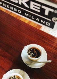 High angle view of coffee cup on table