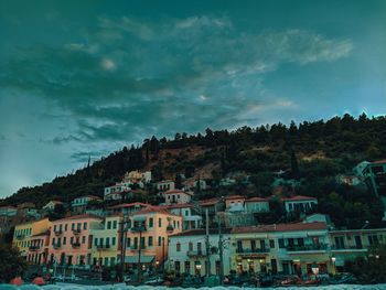 Buildings in town against sky