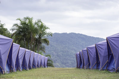 Panoramic view of tent on field against sky