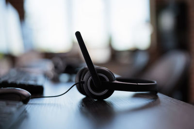 Close-up of in-ear headphones on table