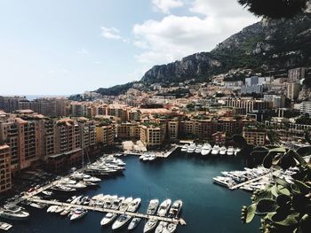 High angle view of harbor and buildings in city