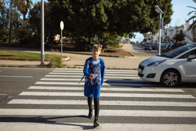 Rear view of woman walking on street