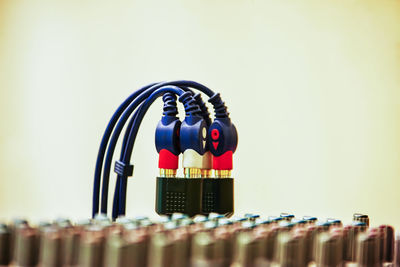 Close-up of electrical wire against white background