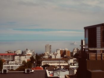 High angle view of buildings in city against sky