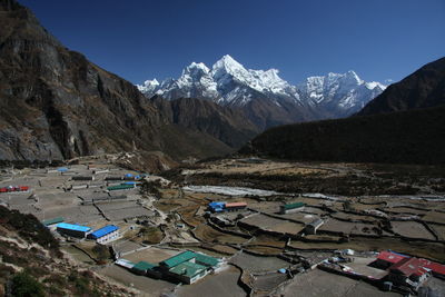 High angle view of snowcapped mountains against sky from thame, namche bazaar 