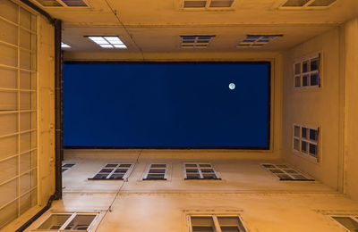 The moon over the buildings by night