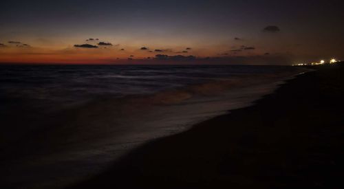 View of beach at sunset