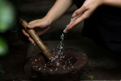 Cropped hands preparing food