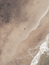 High angle view of people skiing on desert