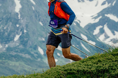 Rear view of man walking on mountain