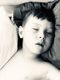 Portrait of cute girl lying on bed