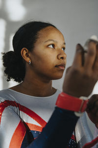 Contemplative female athlete day dreaming about life goal