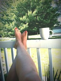 Low section of woman relaxing outdoors