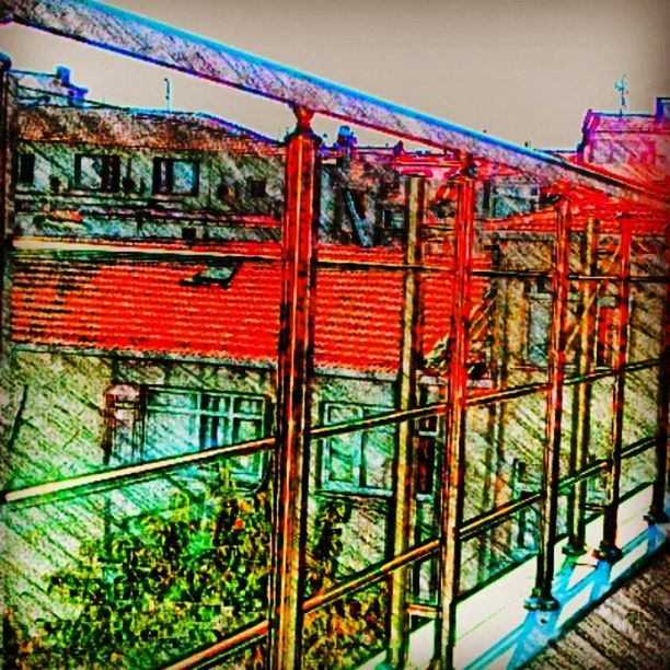 architecture, built structure, railing, building exterior, multi colored, low angle view, red, metal, day, pattern, art, no people, outdoors, art and craft, design, clear sky, steps, house, creativity, roof