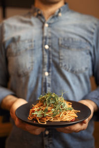 Midsection of woman having food