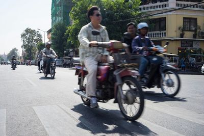 Blurred motion of people on road