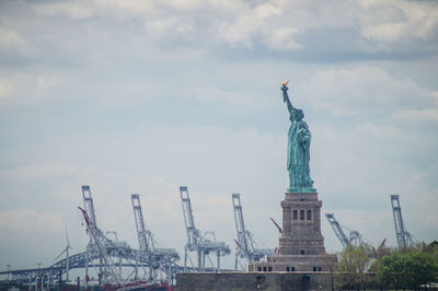 Statue of liberty against cloudy sky