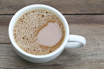 High angle view of coffee cup on table