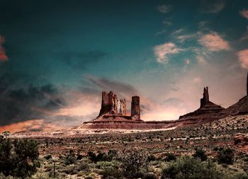 View of rock formations on landscape against sky