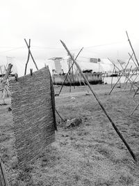 Fence on field against sky