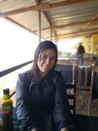 Portrait of woman sitting in restaurant