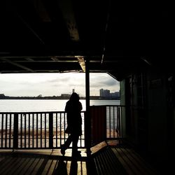 Woman standing against sky