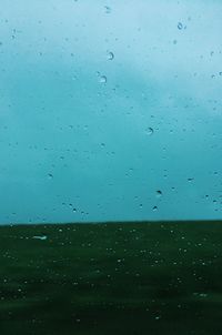 Full frame shot of raindrops on glass window