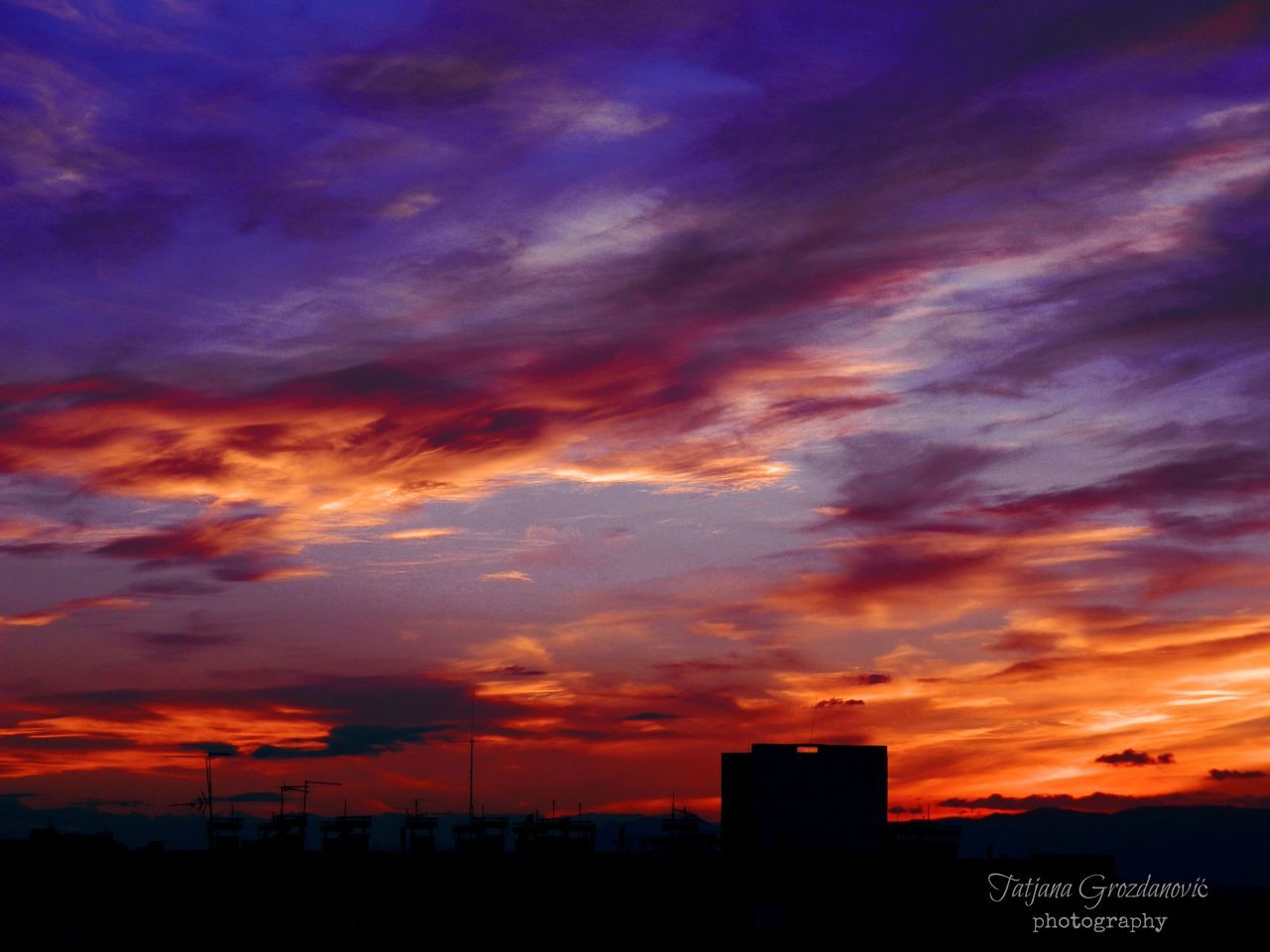 sunset, silhouette, sky, orange color, scenics, beauty in nature, cloud - sky, dramatic sky, tranquil scene, tranquility, idyllic, nature, cloud, moody sky, cloudy, majestic, atmospheric mood, dusk, built structure, building exterior