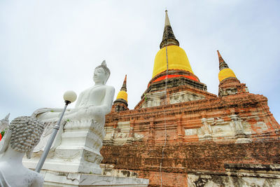 Low angle view of statue of building against sky