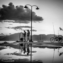 People on street against sky