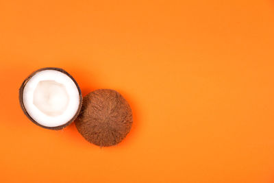 High angle view of coffee on orange table