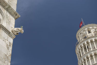 Leaning tower of pisa and sculpture on pisa cathedral