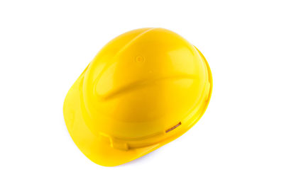 Close-up of yellow hat against white background