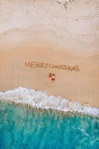 Couple on beach at christmas