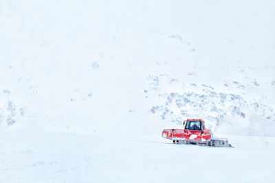 Red toy car on snow