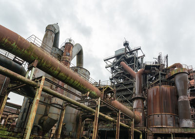 Low angle view of abandoned industry at landschaftspark