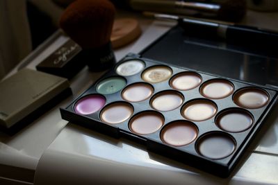 Close-up of makeup on table