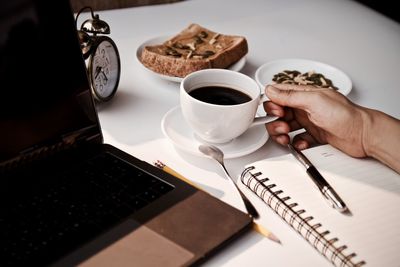 High angle view of coffee cup on table