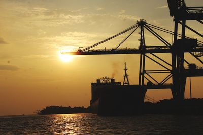 Silhouette of crane at sunset