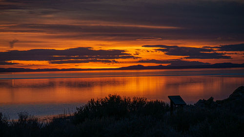 Scenic view of lake against sky during sunset